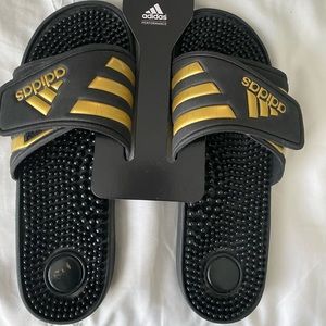 ADIDAS BLACK AND GOLD MASSAGE SLIDES